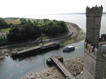 SX28998 Boat passing pedestrian bridge by Caernarfon Castle in river Afon Seiont.jpg